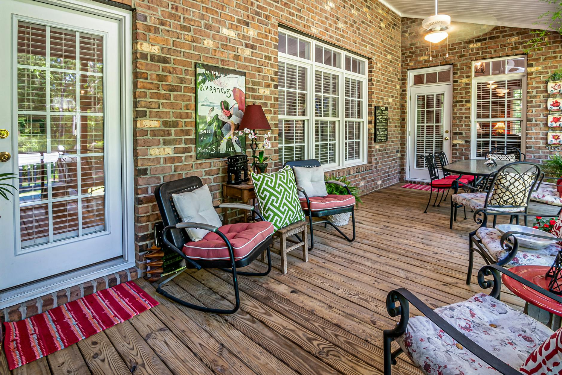 Defined Patio Seating Zone Outdoor Design Comfortable patio seating area on a brick patio with natural wood elements