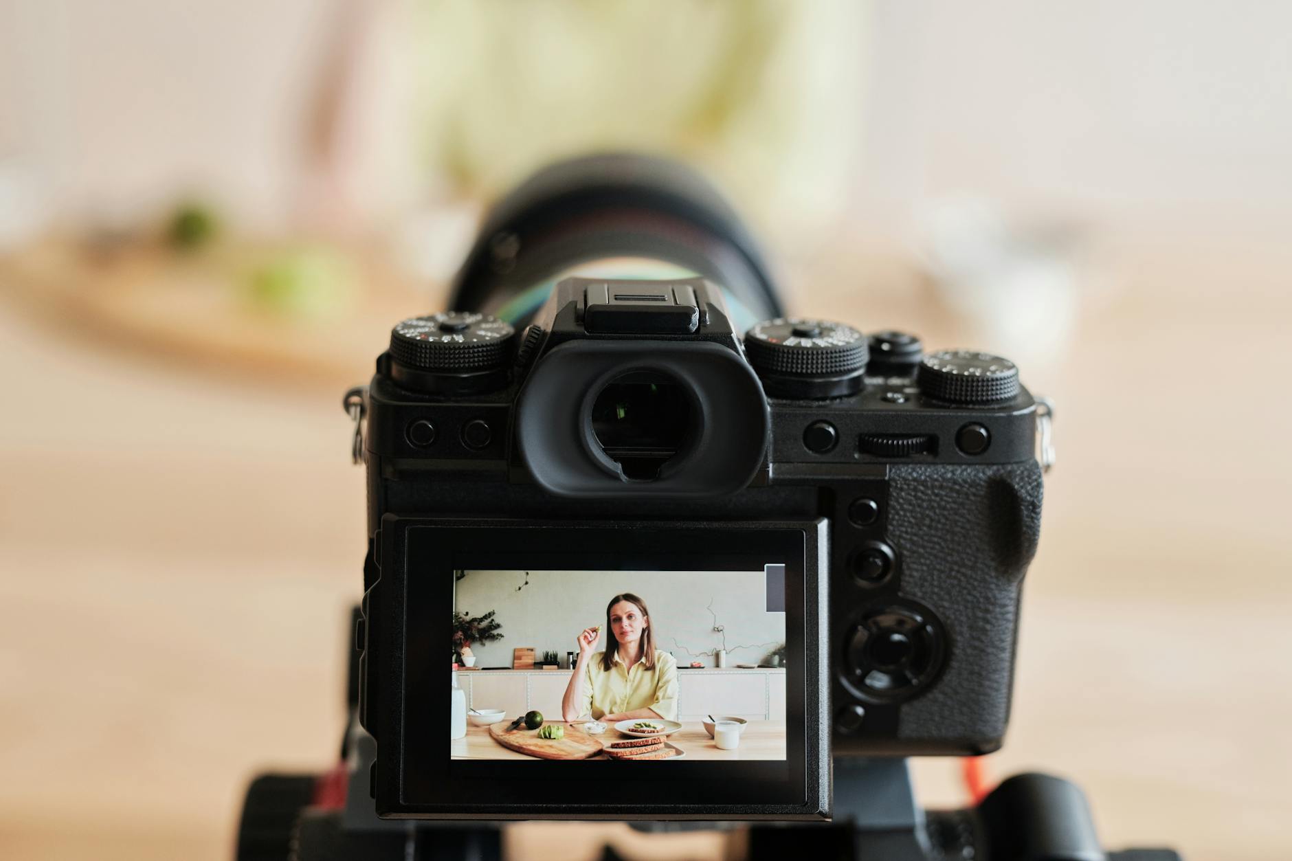 Consistent Home Vlogging Setup for Content Creators Woman vlogging in home studio kitchen setup showing consistent content creation environment