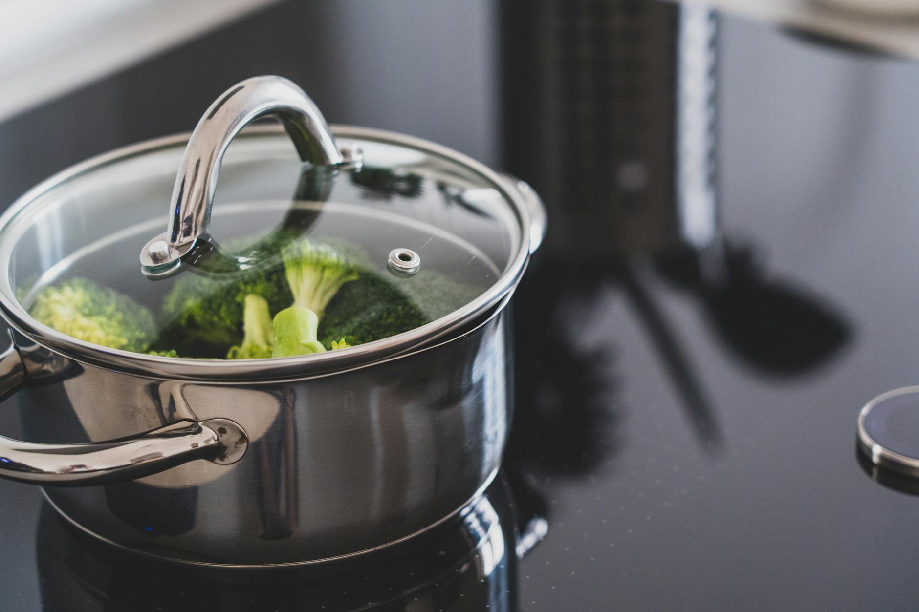 Steaming Vegetables for Maximum Nutrient Retention Broccoli steaming in a stainless steel pot on a stovetop — one of the healthiest cooking methods
