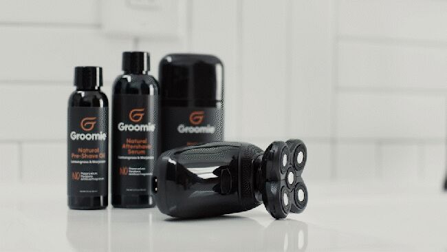 BaldiePro Head and Body Shaver in Use 2026 BaldiePro Groomie head shaver being used on body and leg demonstrating wet and dry versatility