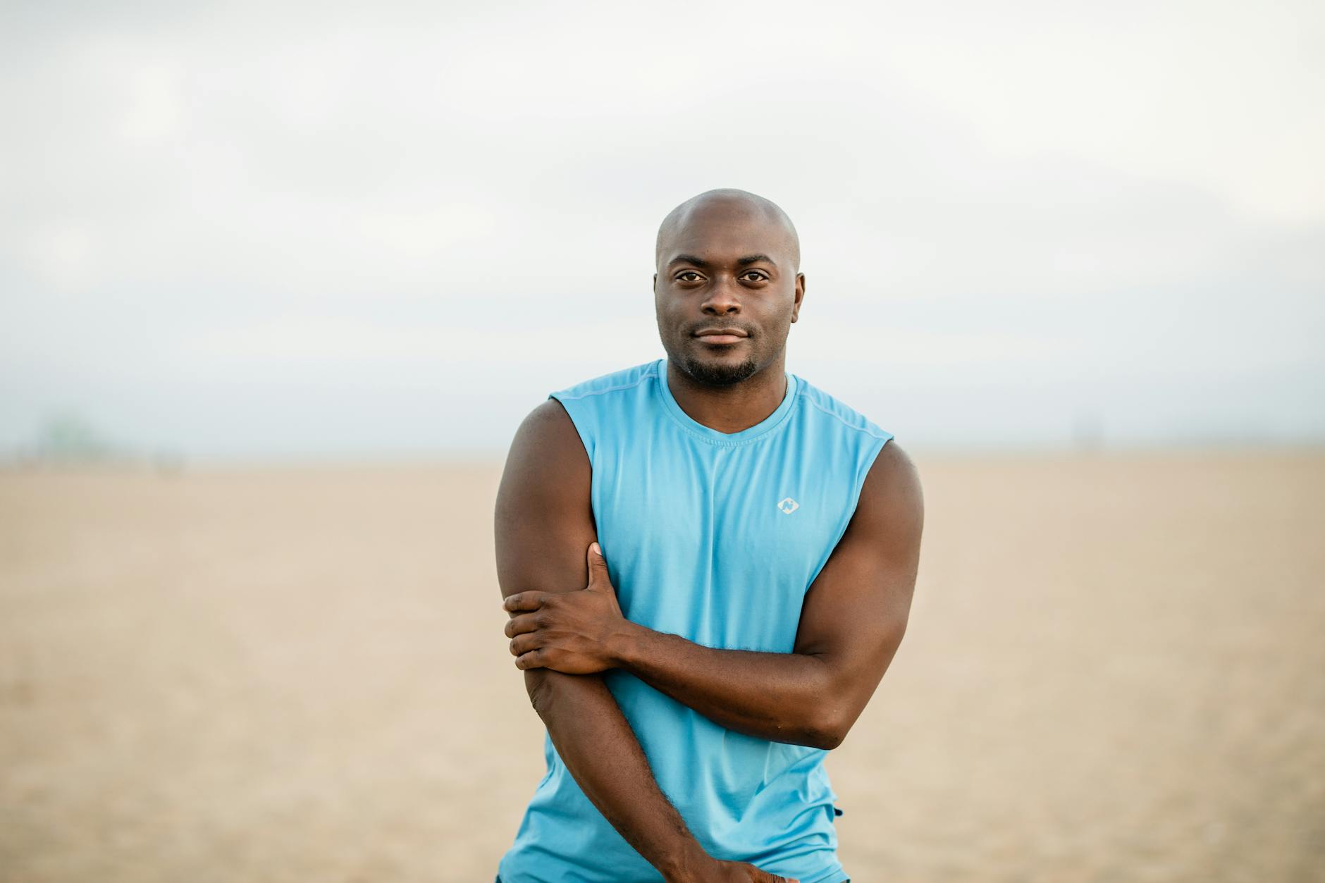 Self-Confidence and Comfortable Body Language in Men A confident man smiling and comfortable in his own skin outdoors