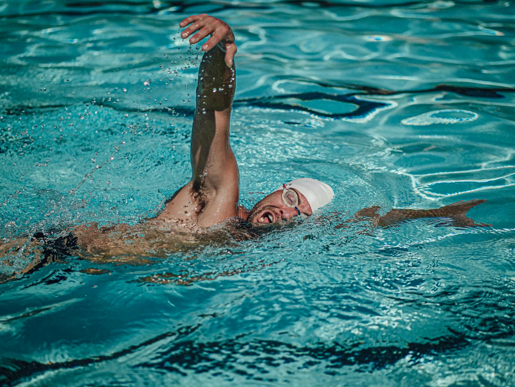 Swimmer Breathing Technique for Athletic Performance Competitive swimmer using controlled breathing technique during freestyle
