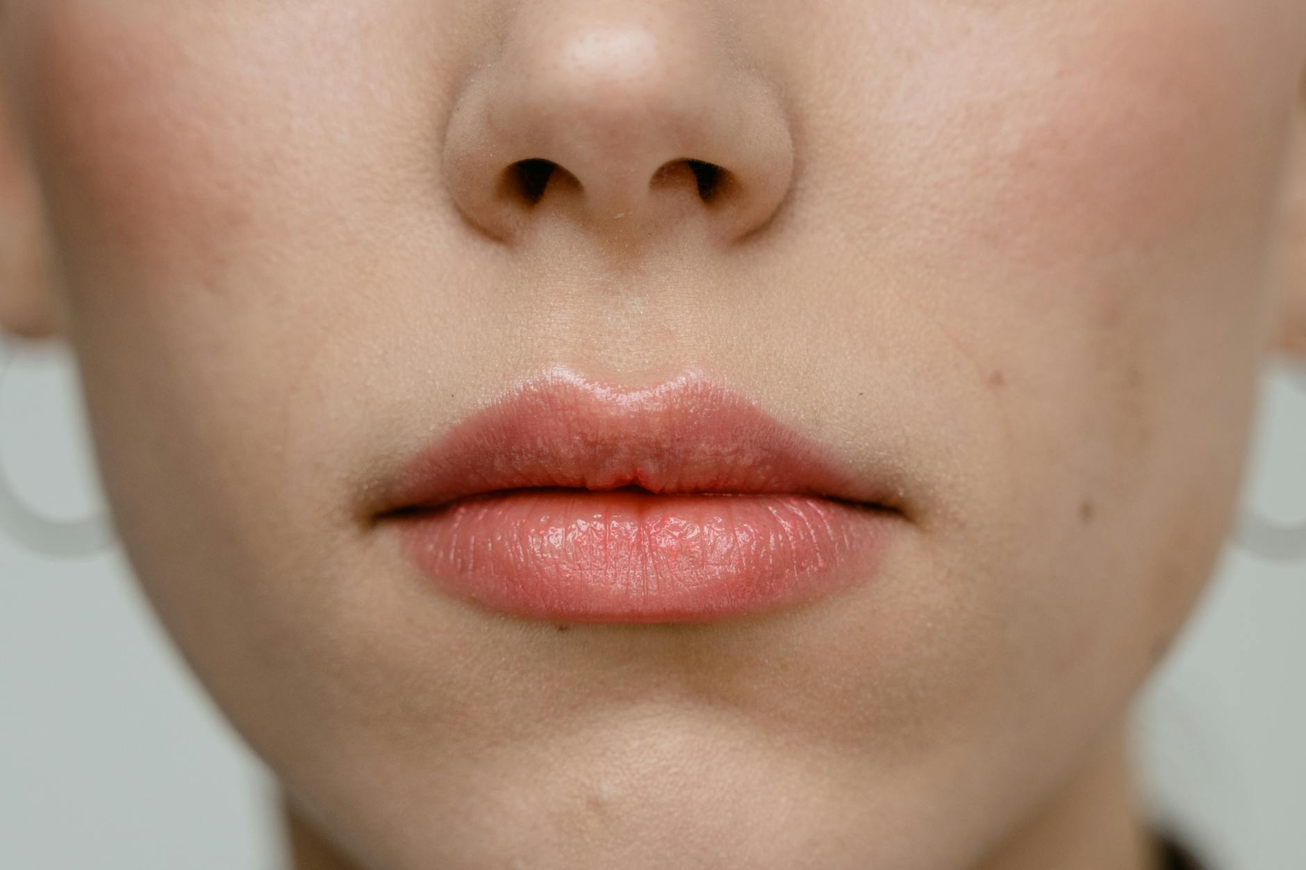 Woman Face Beauty Skin Close Up Close-up of a woman's face showing clear skin — the result of consistent skincare and hair removal care