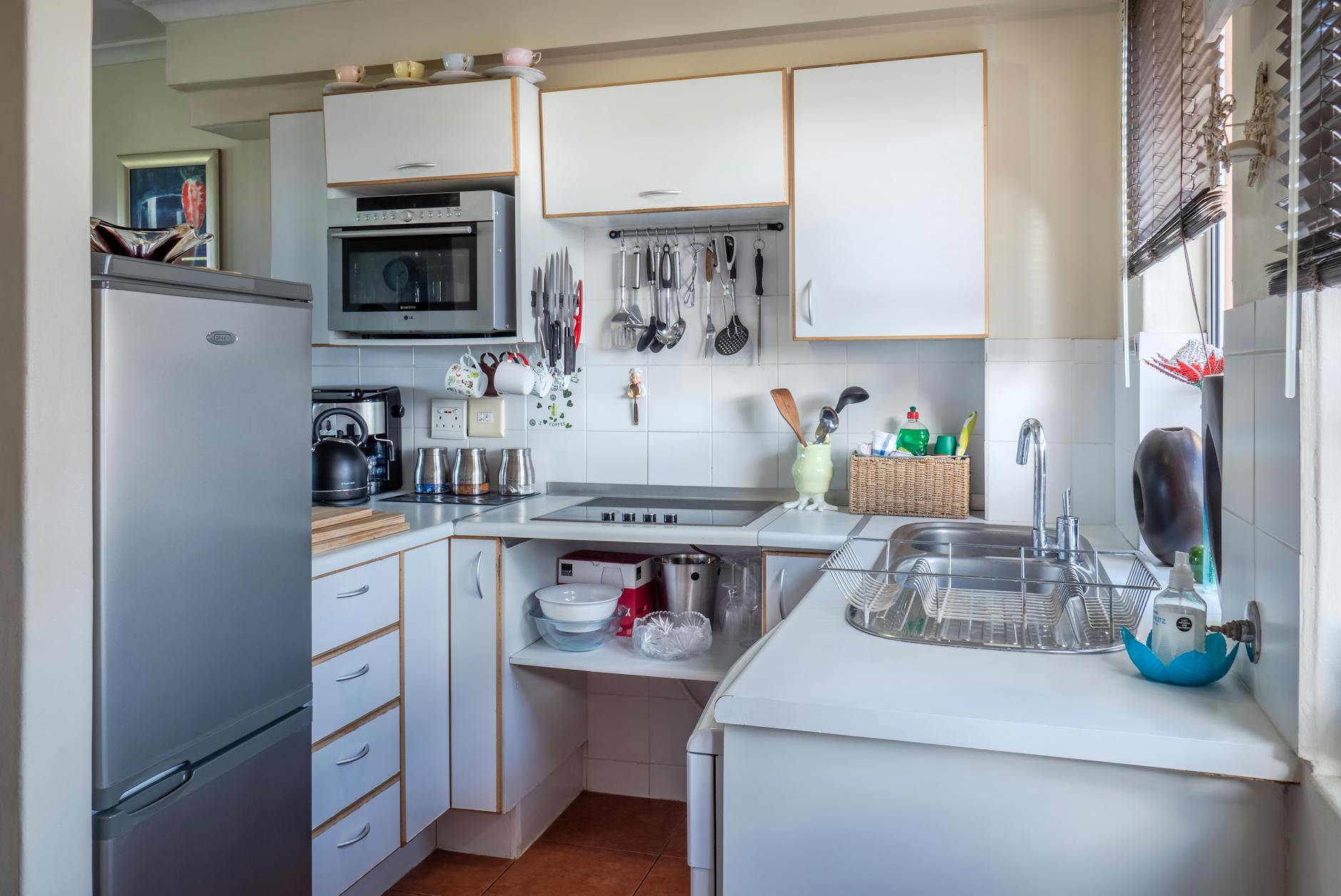 The Result of Good Cleaning Habits — Organized, Clean Home Clean, organized modern kitchen — the result of avoiding common cleaning mistakes