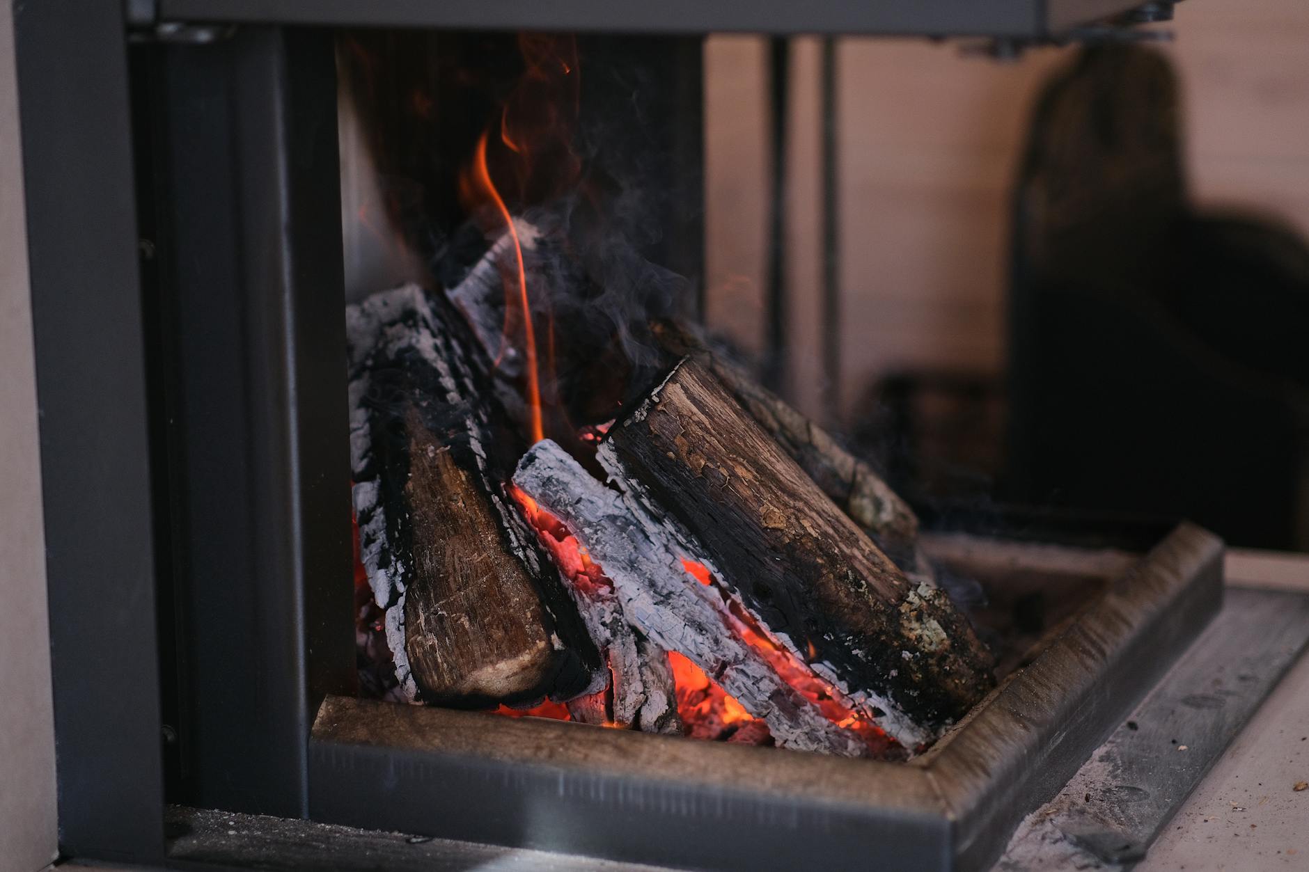 Home Fireplace Heating Safety Firewood burning in a home fireplace — a common source of residential heating fires
