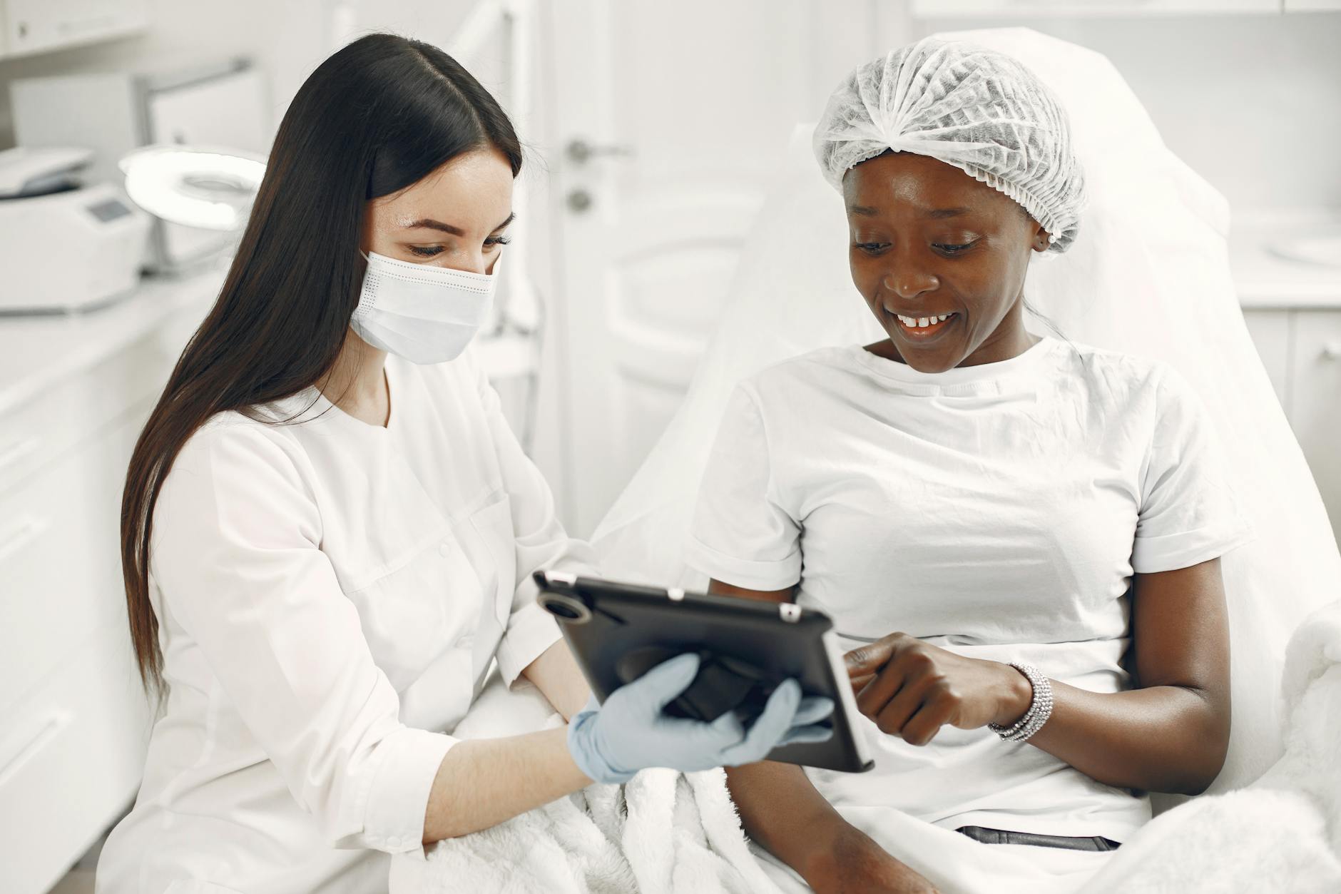 Dermatologist Skincare Consultation Before Dermaplaning Dermatologist consulting with patient about skincare treatment options
