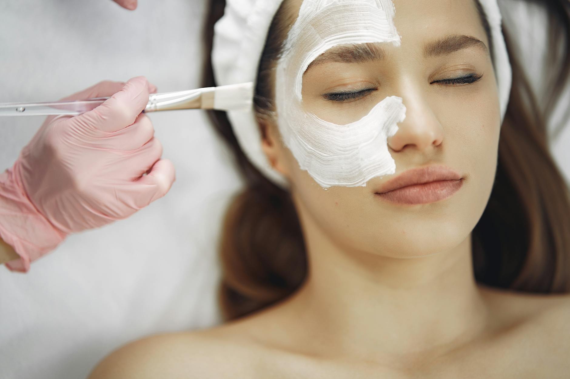 Professional Dermaplaning and Skincare Treatment at a Spa Professional spa facial skincare treatment with mask being applied