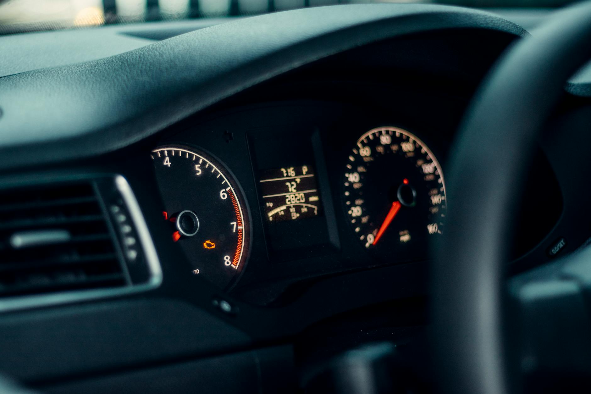 A clean dashboard reduces visual noise and supports driver focus Clear, uncluttered car dashboard showing gauges — a well-organized vehicle interior supports focused driving