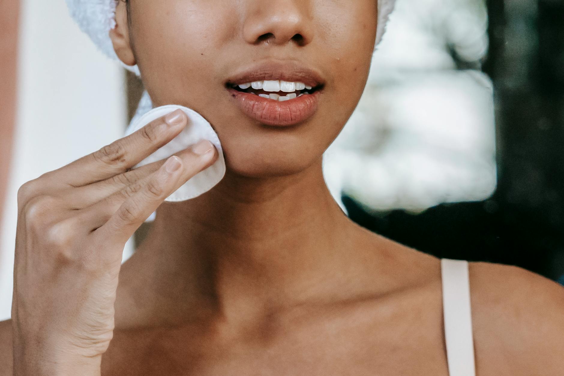 Gentle Skincare After Facial Hair Removal Woman applying skincare as part of a gentle facial hair removal routine
