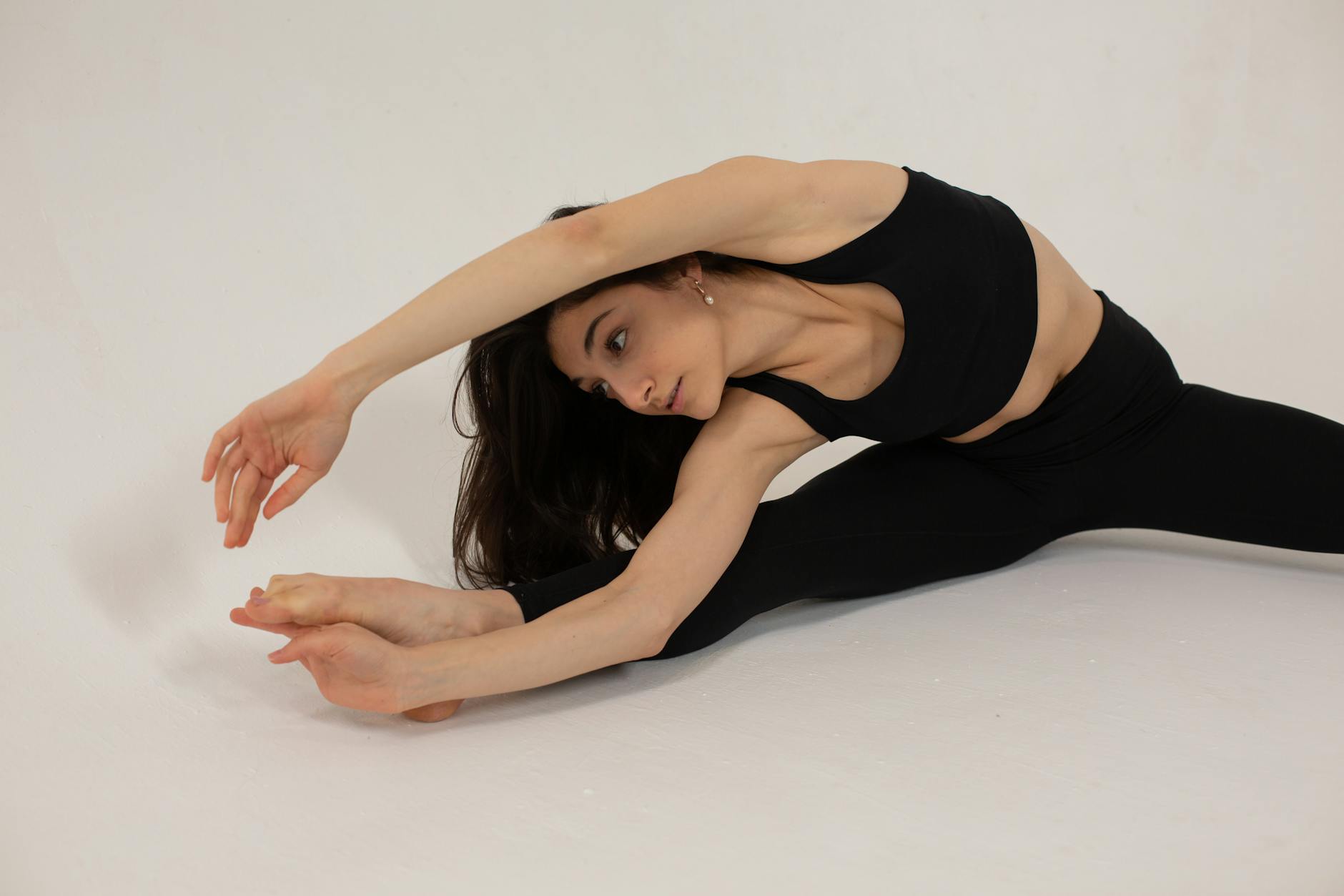 In-Seat Stretching Exercises for Leg Health During Travel Woman demonstrating a stretching exercise — similar movements help prevent DVT on long flights