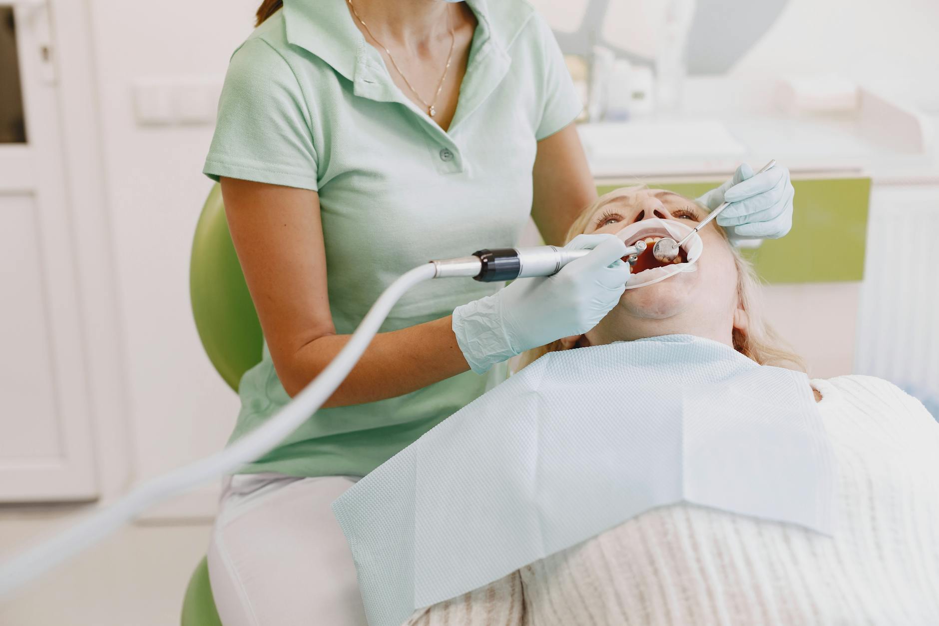 Professional Dental Examination for Early Cavity Detection Dentist performing a thorough oral examination to detect early signs of tooth decay