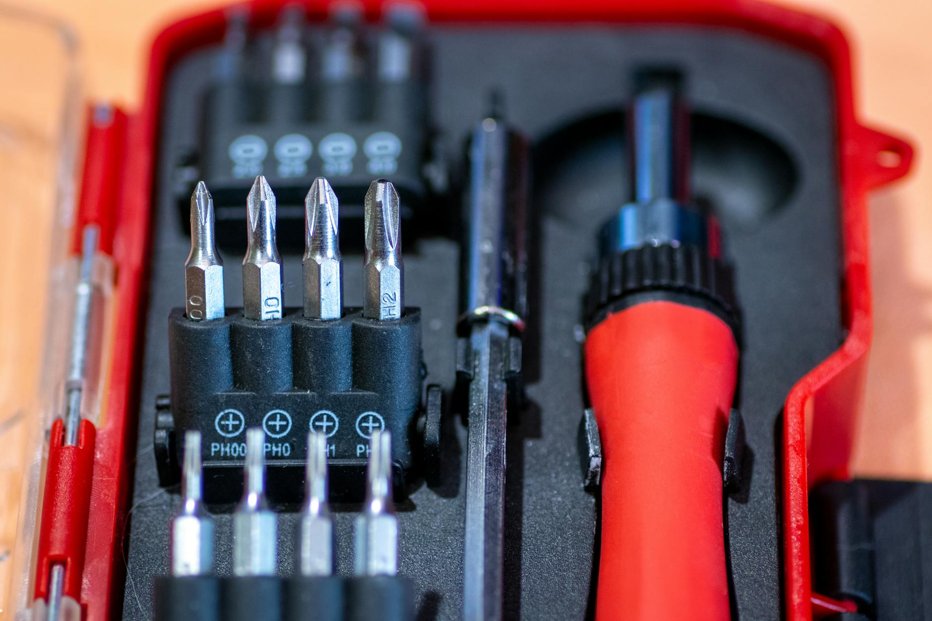 Beginner DIY Screwdriver Set for Home Repairs Screwdriver set in red case with interchangeable bits for beginner DIY household repairs