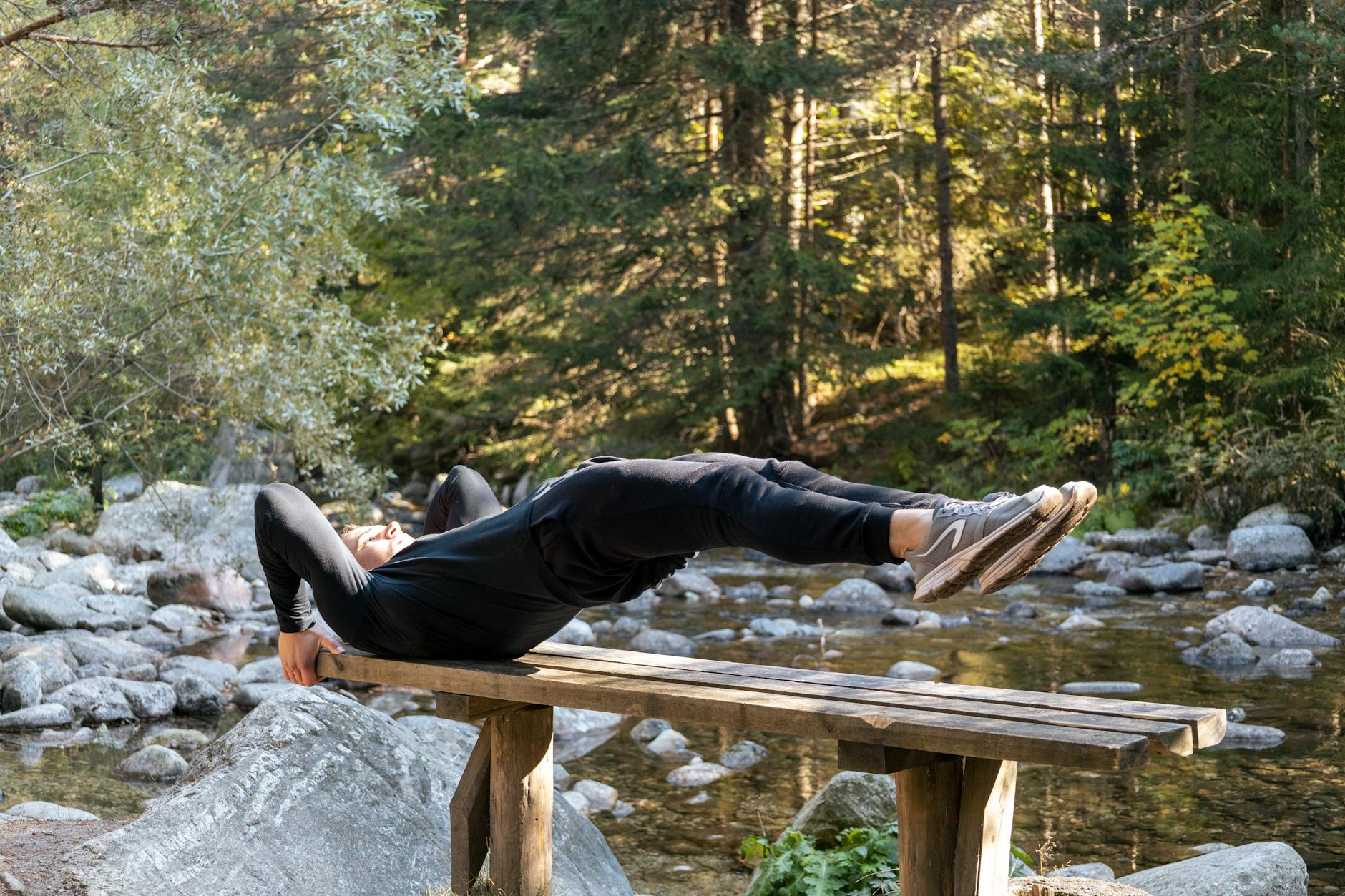 Core Exercise for Golf Fitness Athlete performing a core exercise outdoors — essential training for golf rotational power