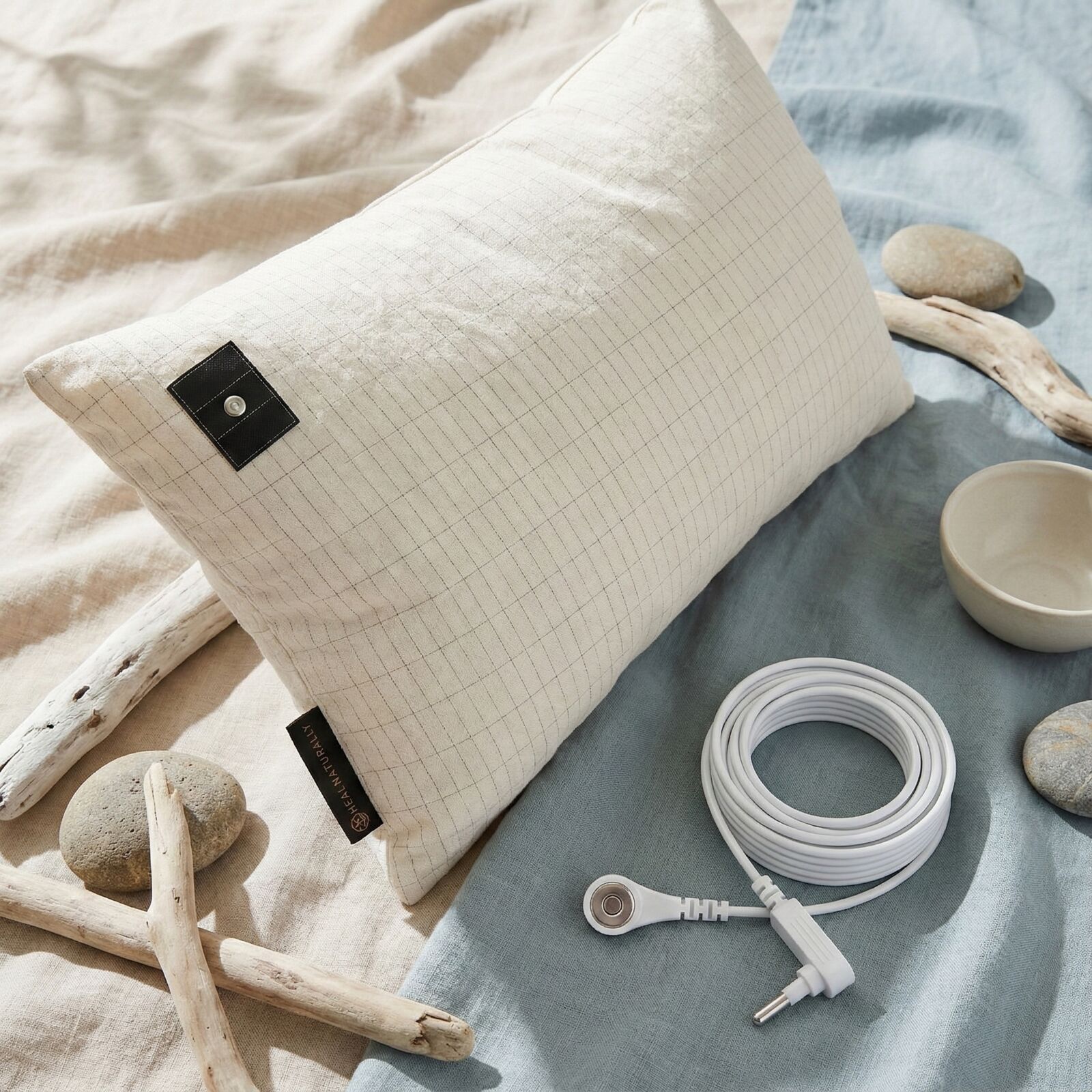 Heal Naturally Grounding Sheet Setup and Connection 2026 Grounding sheet connection point showing silver fiber snap connector setup