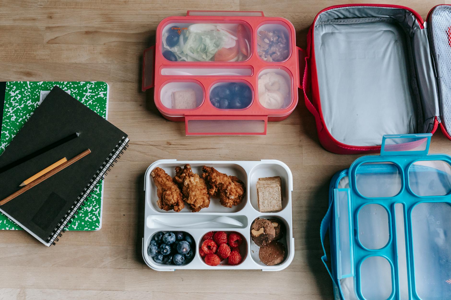 Nutritious School Lunchbox with Healthy Drink Options Overhead view of a nutritious packed lunchbox with fresh fruits and whole foods for school