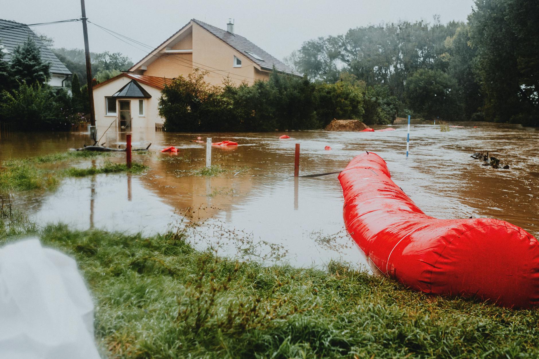 Disaster Preparedness — Flood Protection 2026 Residential area protected by flood barriers — disaster preparedness for families