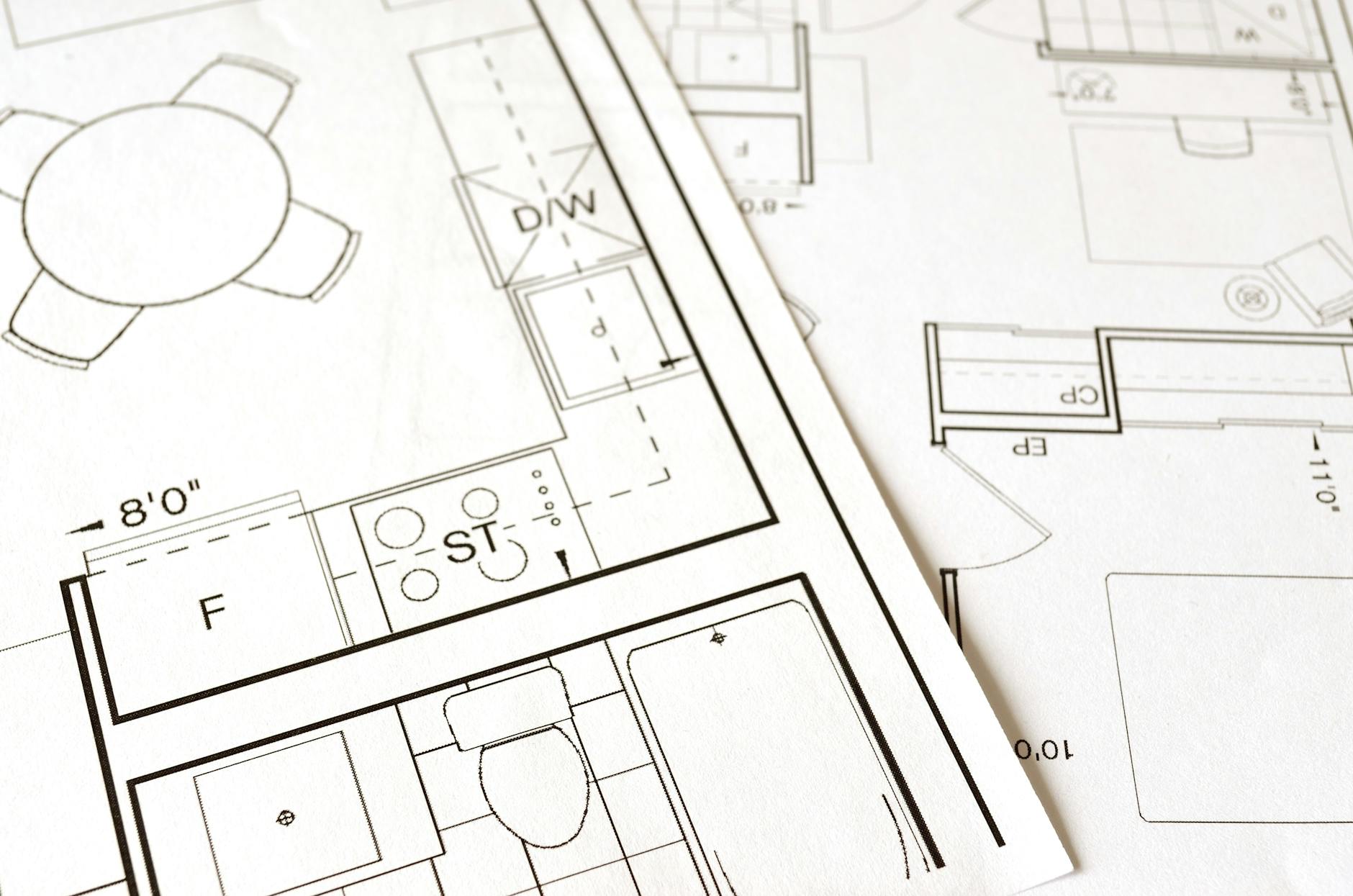 Home Floor Plan for Fire Escape Planning Close-up of an architectural floor plan on paper showing room layouts — similar to what a home fire escape plan map looks like
