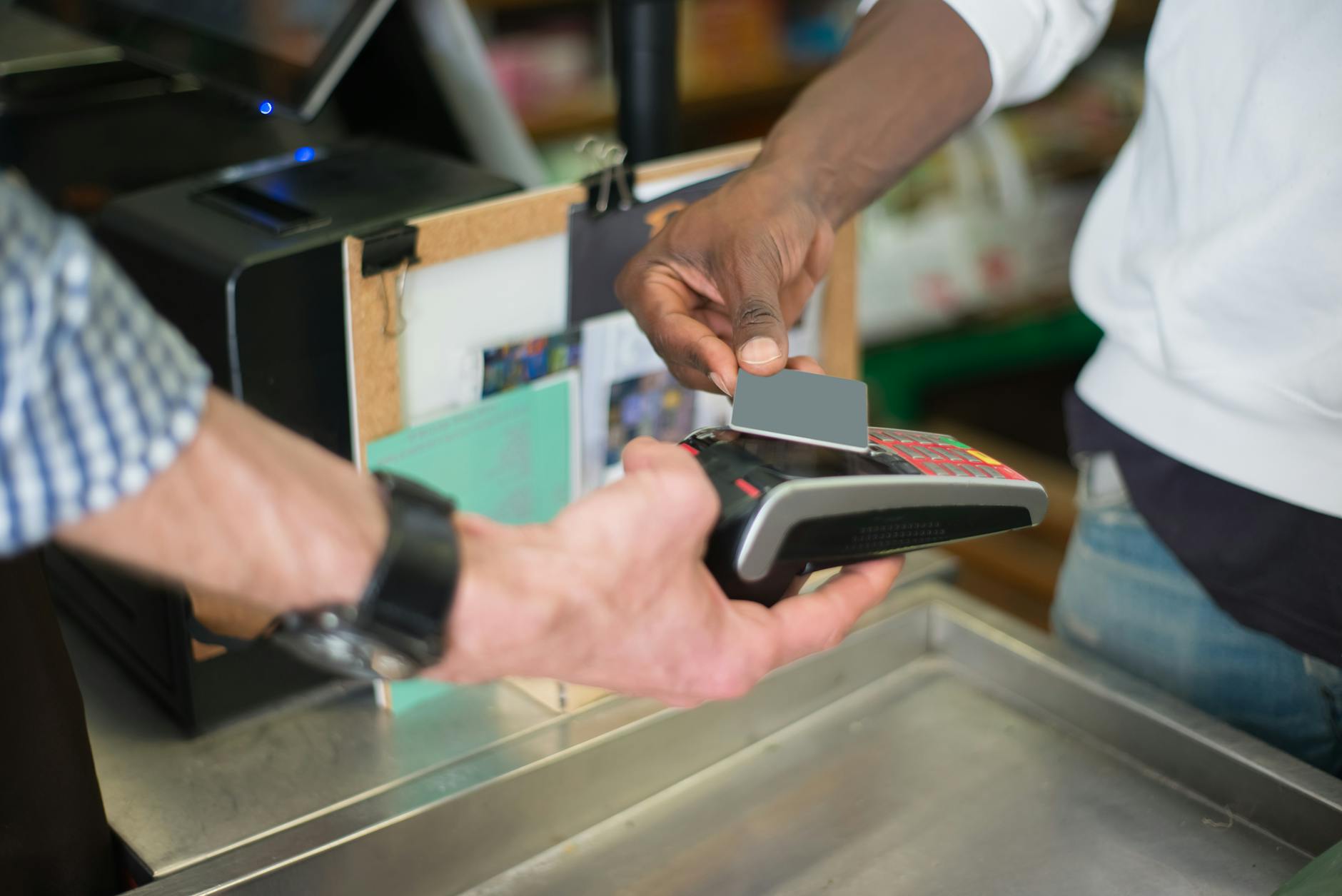 Tap to Pay Contactless Payment at Retail Checkout Customer using tap to pay contactless card at a retail store checkout