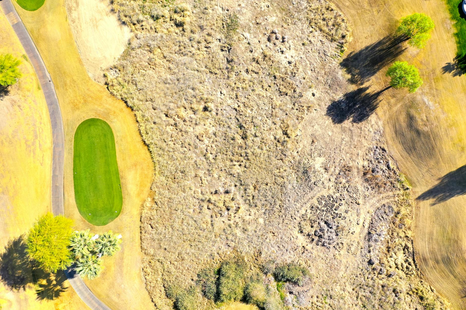 Golf Course Aerial View Aerial view of a golf course showing greens, fairways, and natural terrain