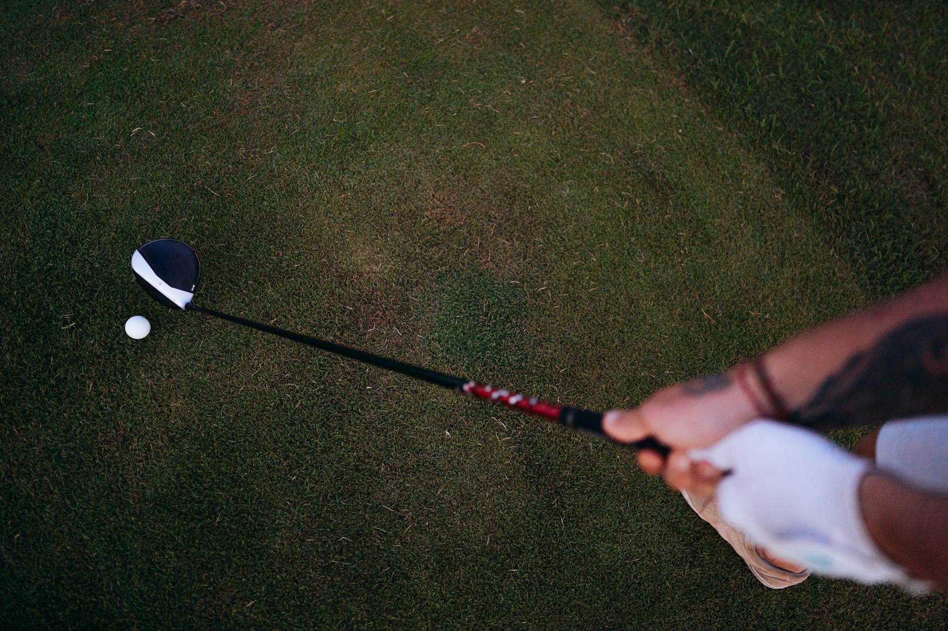 Golf Grip Pressure and Setup for Distance Golfer at address position preparing to swing, showing gloved grip on the club