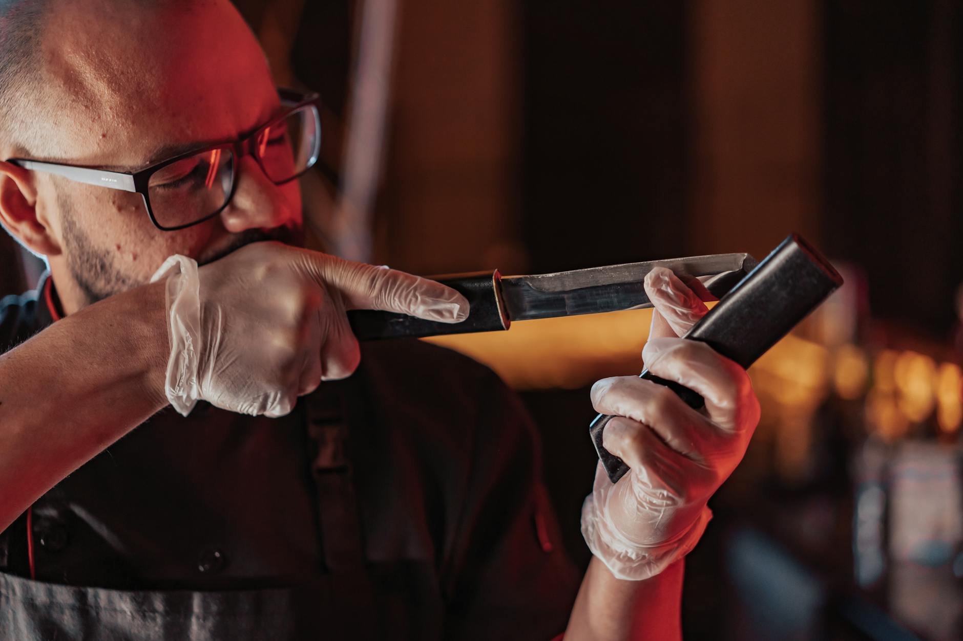 Proper Knife Sharpening Technique at Home Chef sharpening a kitchen knife with precision and proper technique