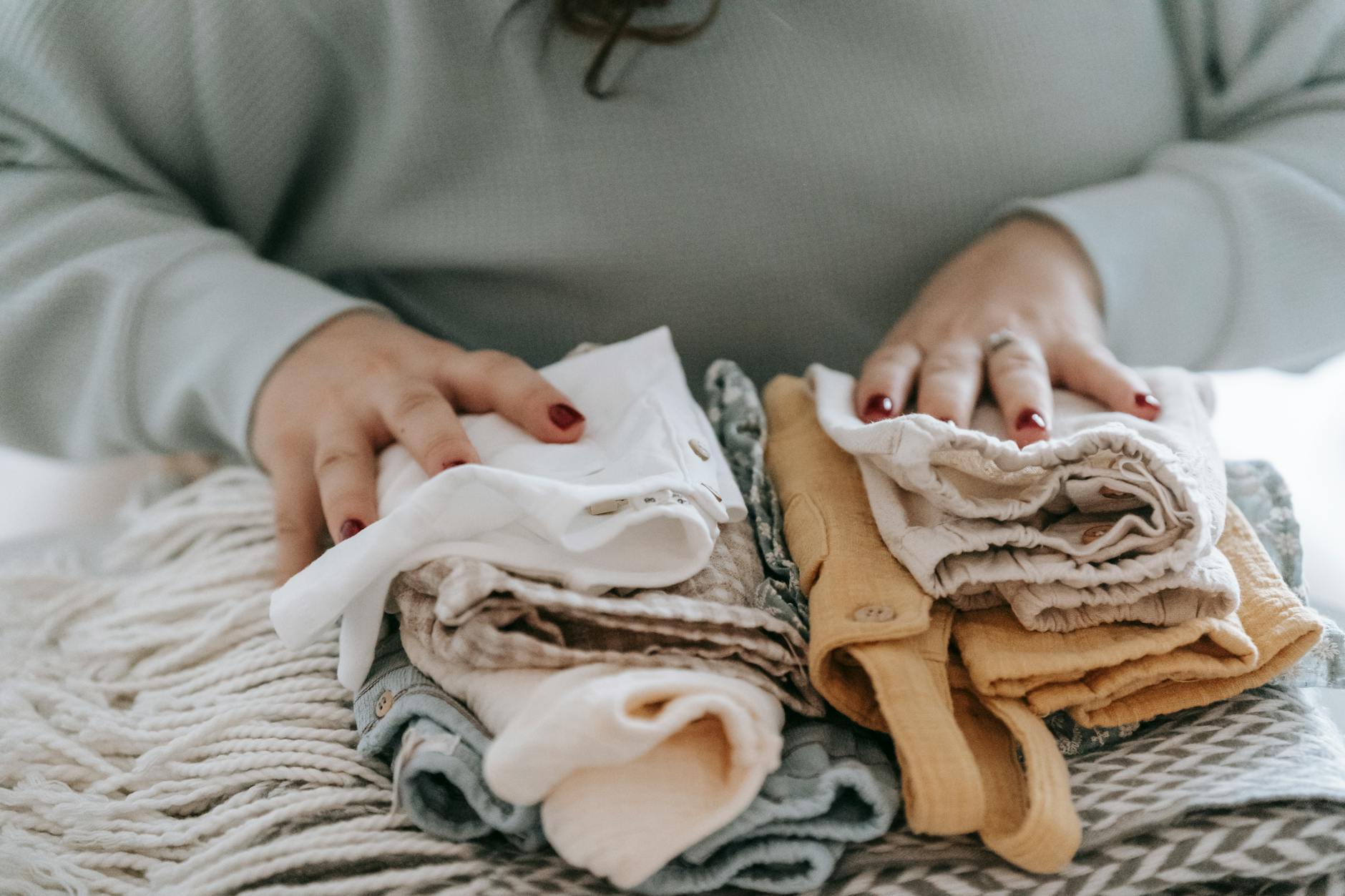 Folding Clean Clothes — The Final Step in Doing Laundry Correctly Neatly folding and organising clean laundry after washing correctly