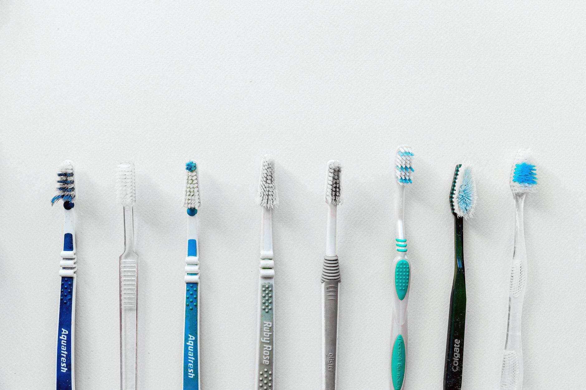 Oral Hygiene Tools for Heart Health Toothbrushes representing daily oral hygiene practice — brushing twice daily is one of the most effective ways to control the bacteria that drive periodontal disease