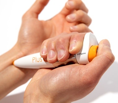 Paingone Plus Wrist and Joint Application 2026 Paingone Plus TENS pen being applied to the wrist area for pain relief