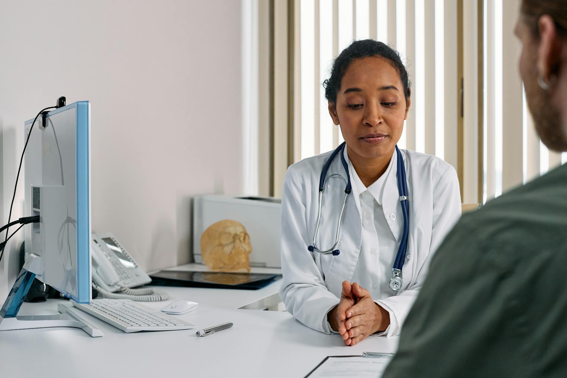 Woman at doctor consultation - PCOS medical treatment Female doctor consulting with a patient in a medical office about PCOS treatment options
