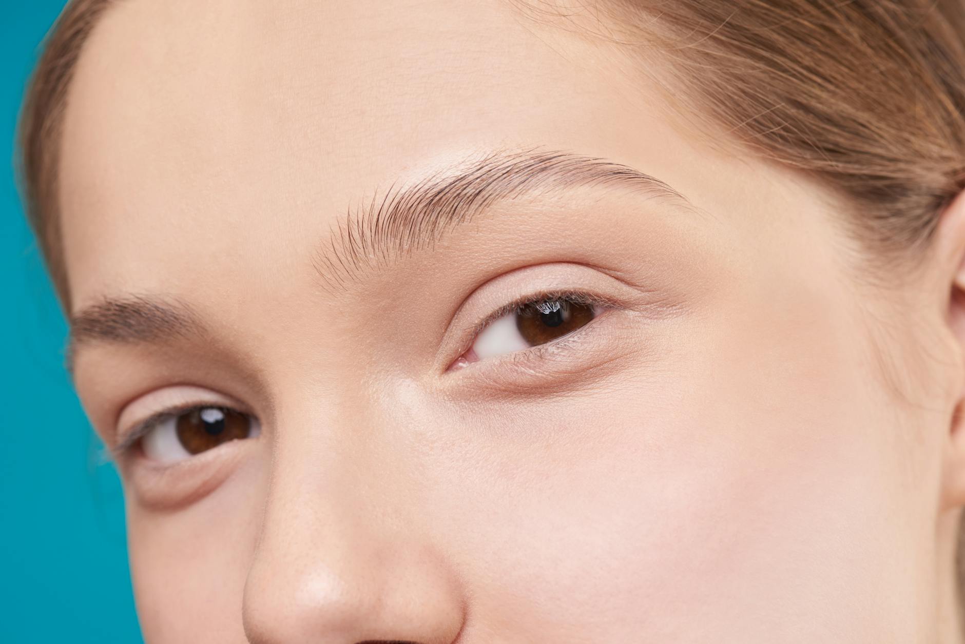 Vellus hair on natural skin - peach fuzz on face Close-up of a woman's natural skin showing fine facial hair texture