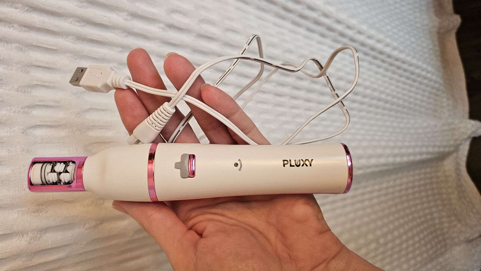 Pluxy Facial Epilator Unboxing 2026 Hands holding Pluxy Epil Pro device and packaging during unboxing