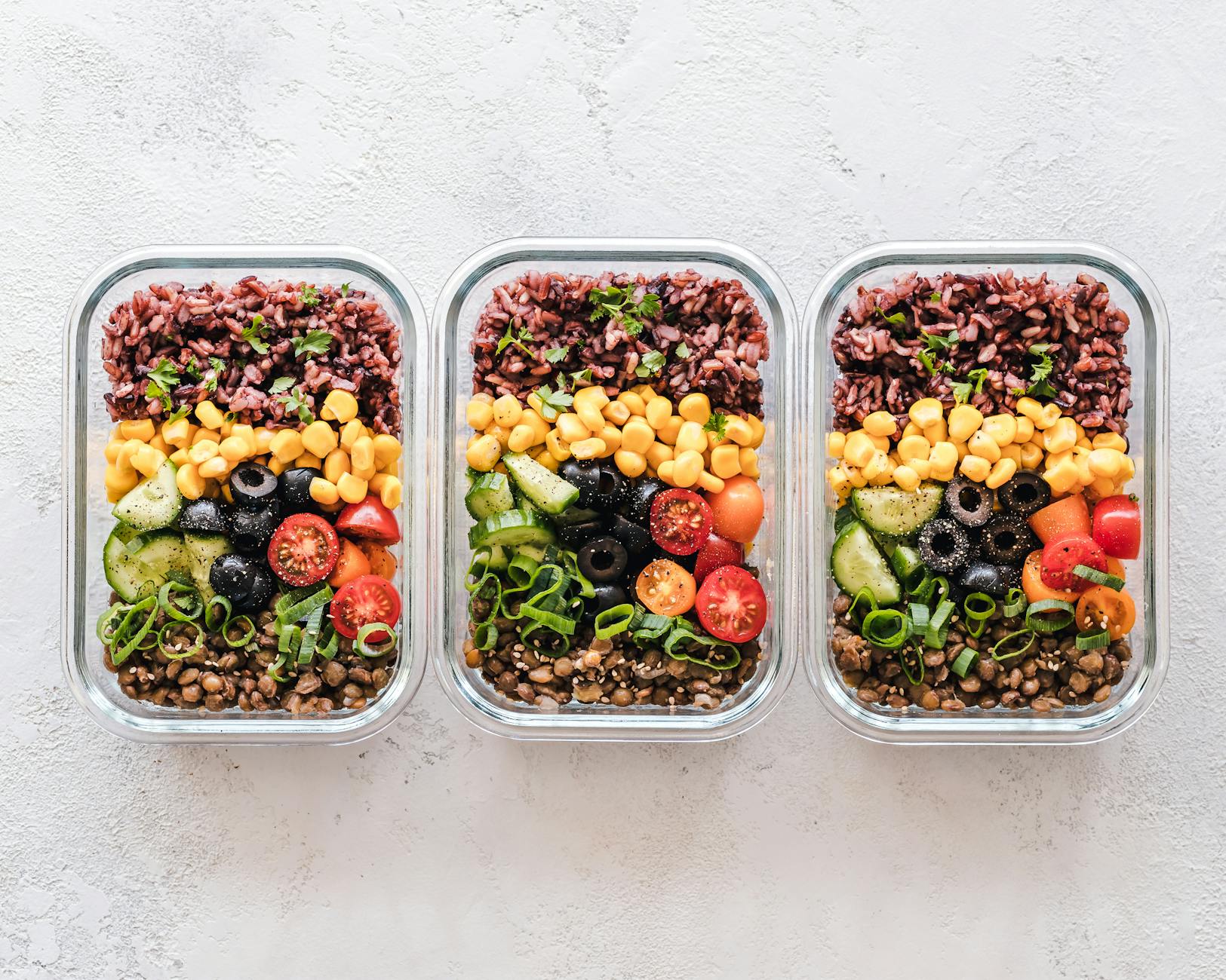 Road Trip Food Organization in Containers 2026 Healthy meal prep with vegetables and grains in glass containers — a great system for road trip snack organization