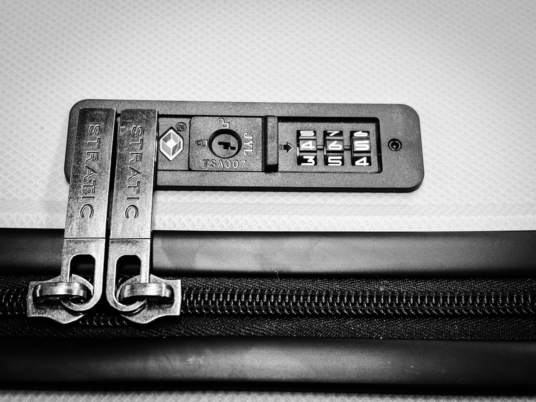 TSA Tool Rules and Luggage Security 2026 TSA-approved lock on a suitcase representing travel security compliance